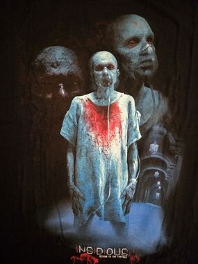 Insidious: Return to the Further Graphic Horror Tee - Black w/Blue and Red print